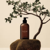 Amber Dispenser Cosmetic Bottle Mockup with Tree